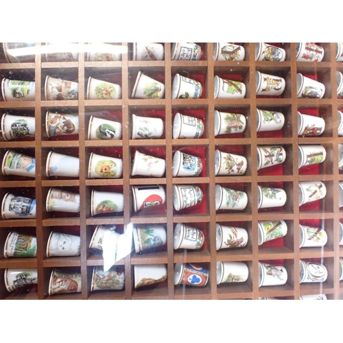 96 - A COLLECTION OF THIMBLES with display cases