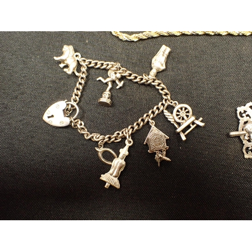 470 - A SILVER CHARM BRACELET, A SMALL PEARL NECKLACE WITH 9CT CLASP an Indian white metal bracelet, and o... 