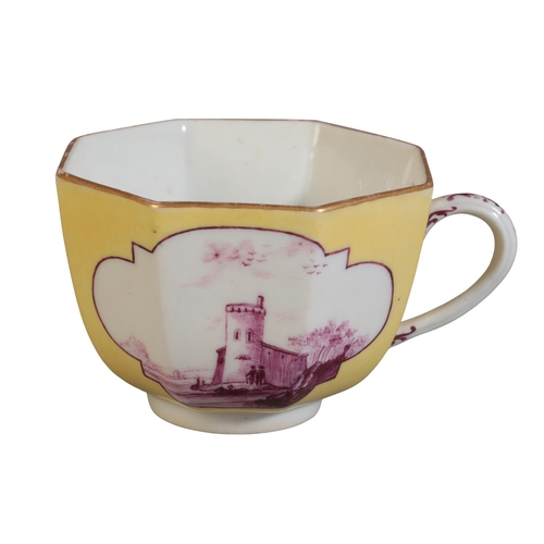 474 - A MEISSEN PORCELAIN TEACUP

mid 18th century, of yellow ground, decorated with architectural landsca... 