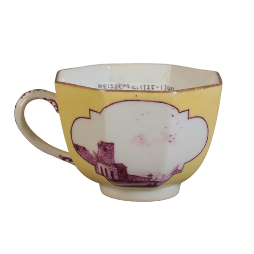 474 - A MEISSEN PORCELAIN TEACUP

mid 18th century, of yellow ground, decorated with architectural landsca... 