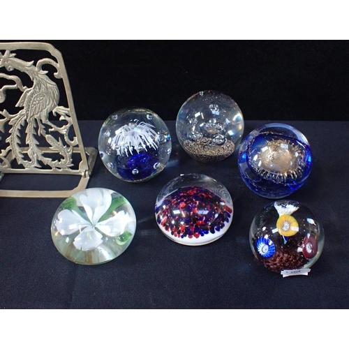 19 - SEVEN GLASS PAPERWEIGHTS AND A PAIR OF BRASS BOOKENDS pierced and cast as pheasants