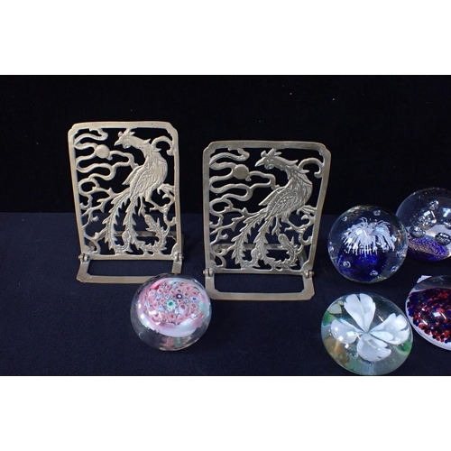 19 - SEVEN GLASS PAPERWEIGHTS AND A PAIR OF BRASS BOOKENDS pierced and cast as pheasants