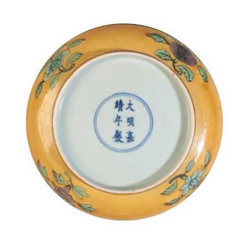 108 - A CHINESE YELLOW-GROUND SAUCER

bearing a six character Jiajing seal mark to the base, decorated to ... 