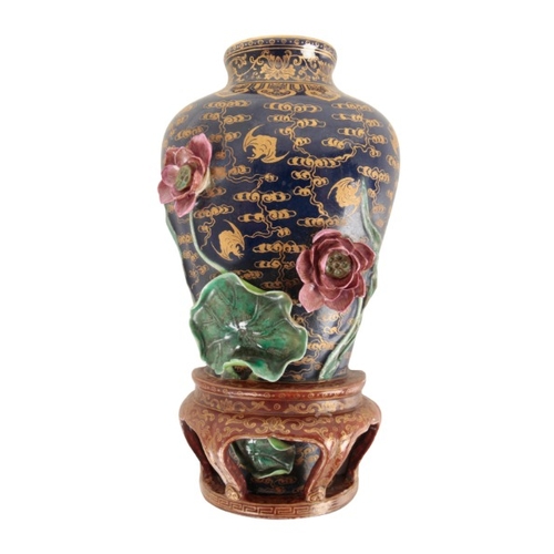 111 - A CHINESE FAMILLE ROSE WALL VASE

bearing a six character Qianlong mark to the base, the blue ground... 