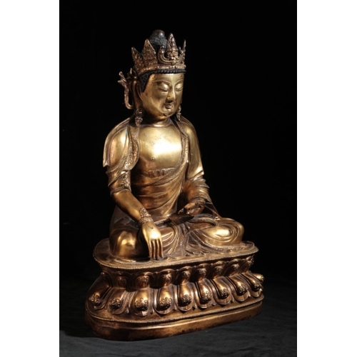 12 - A CHINESE GILT-BRONZE BUDDHA

early Ming or later, the Deity seated on a lotus-leaf base with finely... 