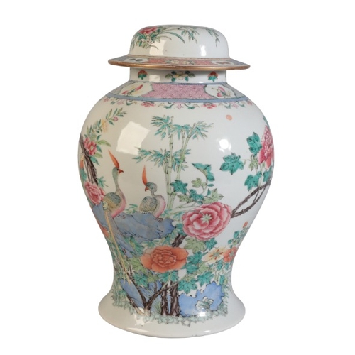 129 - A CHINESE BALUSTER SHAPED VASE AND COVER

19th Century, drilled to cover and base