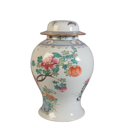 129 - A CHINESE BALUSTER SHAPED VASE AND COVER

19th Century, drilled to cover and base