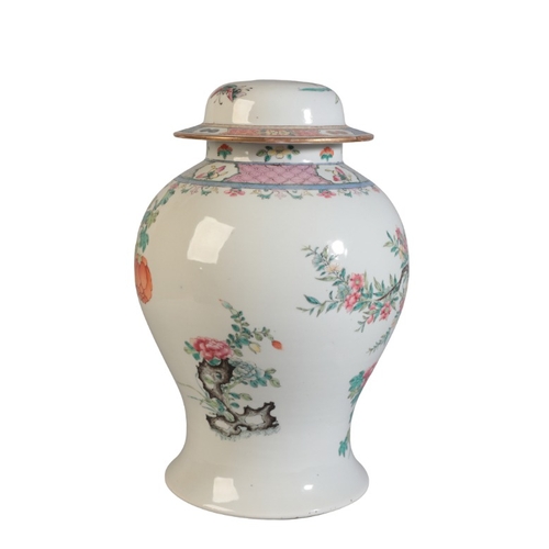 129 - A CHINESE BALUSTER SHAPED VASE AND COVER

19th Century, drilled to cover and base