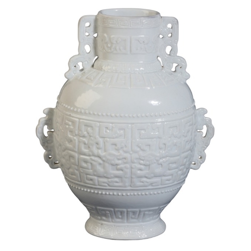 139 - A CHINESE WHITE GLAZED VASE

of archaistic form imitating a bronze vessel with pierced lug handles a... 