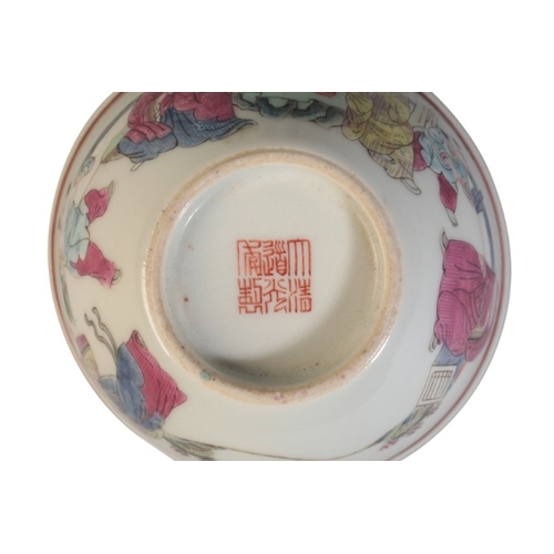 143 - A CHINESE FAMILLE ROSE TEA BOWL

bearing Daoguang seal mark to the base, decorated with scholars and... 