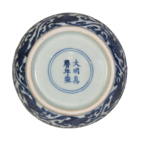 145 - A CHINESE BLUE AND WHITE CUSHION-SHAPED BOX AND COVER

with a divided interior, the lid with a centr... 