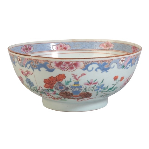 149 - A CHINESE EXPORT FAMILLE ROSE BOWL

19th century, decorated with offerings and a profusion of flower... 