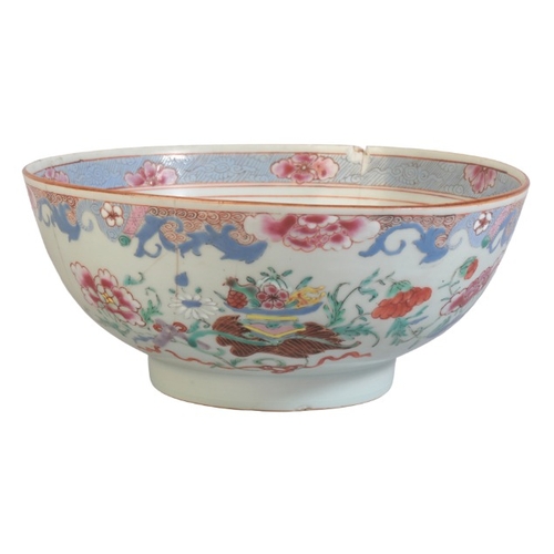 149 - A CHINESE EXPORT FAMILLE ROSE BOWL

19th century, decorated with offerings and a profusion of flower... 