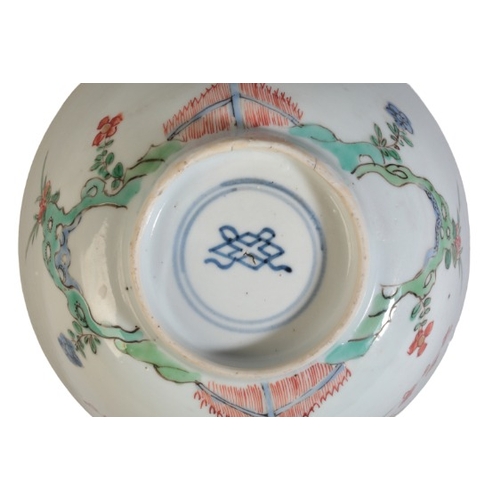 156 - TWO CHINESE EXPORT FAMILLE VERTE BOWLS

18th century, the larger decorated with flowers and having a... 