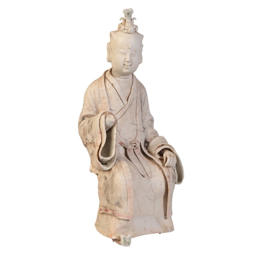 161 - A CHINESE FIGURE OF A SEATED OFFICIAL

Song dynasty or later, figured in gown and headress with righ... 