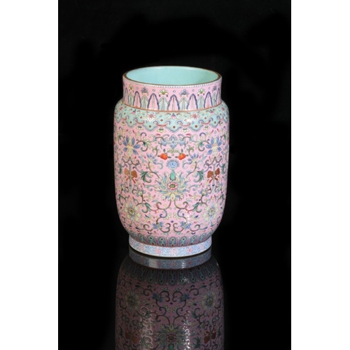 162 - A CHINESE FAMILLE ROSE PINK GROUND SLEEVE VASE

bearing six character Daoguang seal mark to the base... 