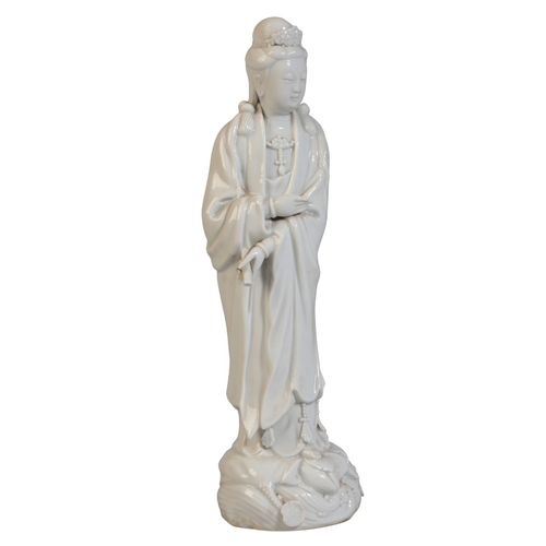 165 - A CHINESE BLANC DE CHINE GUANYIN

19th century or later, stood on lotus base holding scroll in one h... 