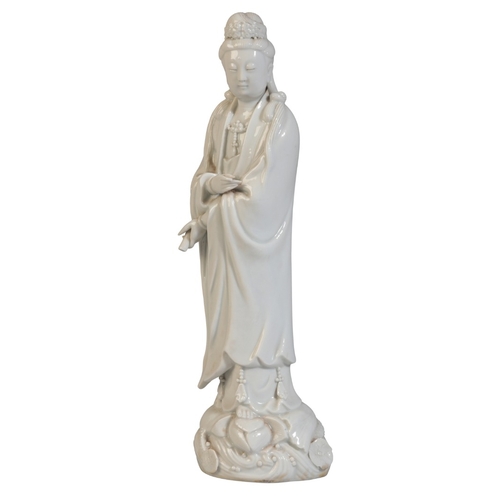 165 - A CHINESE BLANC DE CHINE GUANYIN

19th century or later, stood on lotus base holding scroll in one h... 