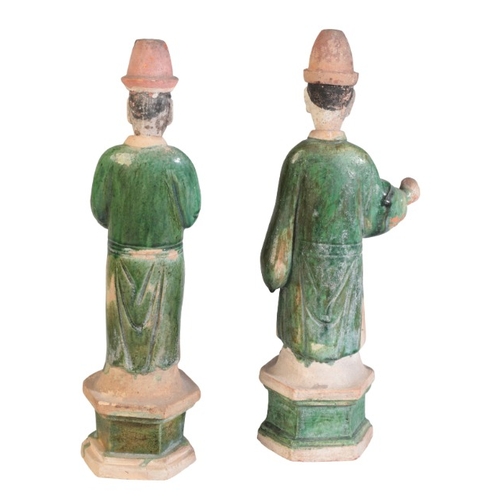 169 - TWO SIMILAR CHINESE SANCAI GLAZED GUARDIAN FIGURES

Ming Dynasty, figured with robes and high hats, ... 