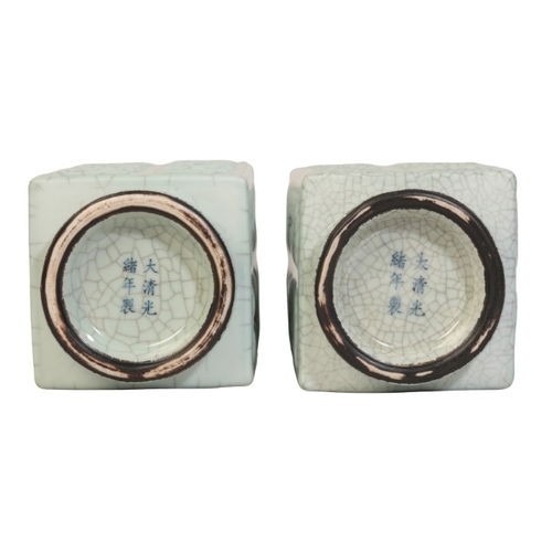 179 - A PAIR OF CHINESE PALE CELADON CONG

Qing or later, with moulded square bodies covered in lustrous c... 