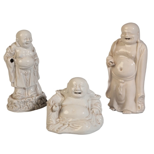 190 - THREE CHINESE BLANC DE CHINE FIGURES OF BUDAI

19th century and later, one reclining with peach in h... 