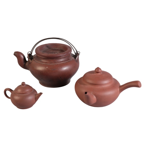 196 - A GROUP OF THREE CHINESE YIXING TEAPOTS

including a large teapot, with two double gourd marks to th... 