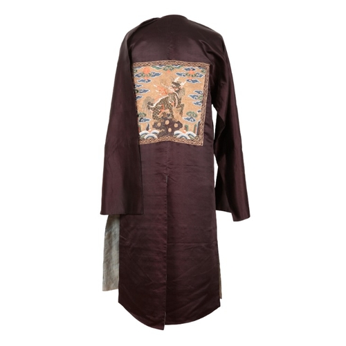 211 - A BLACK SILK CHINESE ROBE WITH QILIN MILITARY RANK BADGES

Qing or late 19th century, embroidered in... 