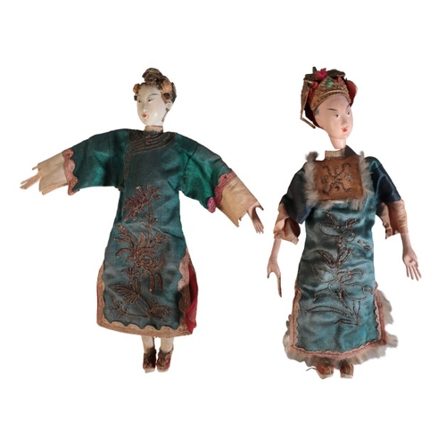 215 - TWO CHINESE POLYCHROME PAINTED WOODEN DOLLS

late Qing/Republic, figured as a man and woman in court... 