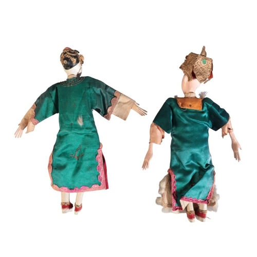 215 - TWO CHINESE POLYCHROME PAINTED WOODEN DOLLS

late Qing/Republic, figured as a man and woman in court... 