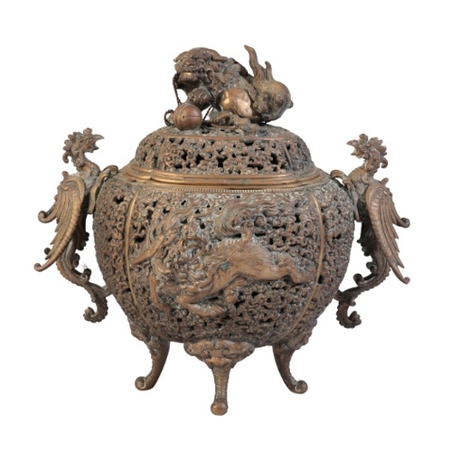 216 - A JAPANESE BRONZE CENSER

Meiji period, signed to the base, the finial in the form of a lion dog, ea... 