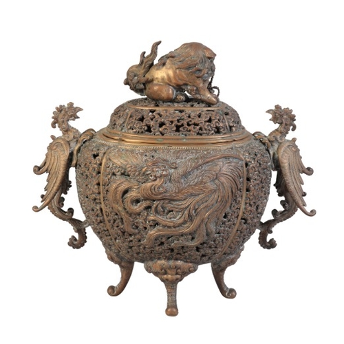 216 - A JAPANESE BRONZE CENSER

Meiji period, signed to the base, the finial in the form of a lion dog, ea... 