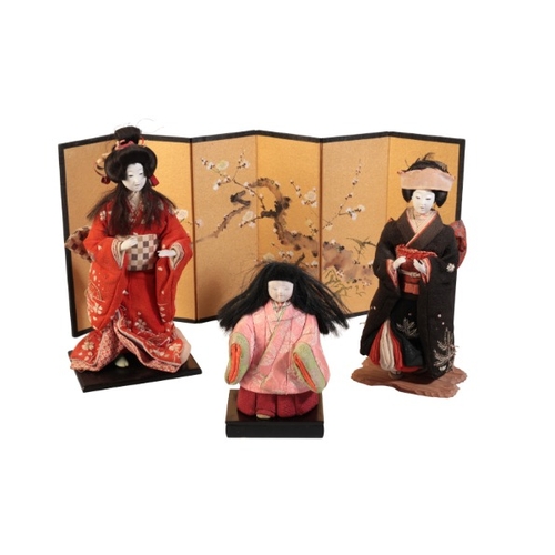 228 - TWO JAPANESE GEISHA DOLLS ON STANDS

Showa, late 20th century, one dressed in orange embroidered kim... 