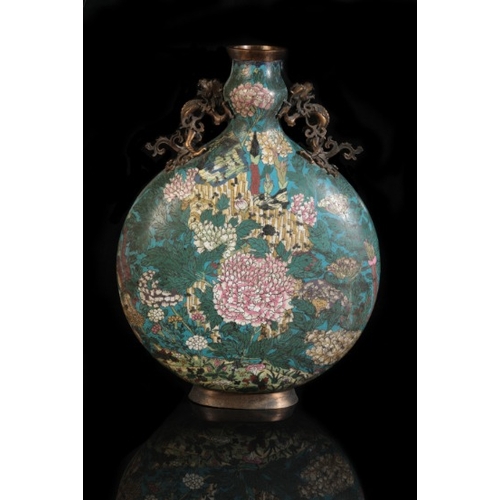 24 - A CHINESE CLOISONNE MOON FLASK

Qing, decorated with peonies against a blue ground, with bronze hand... 