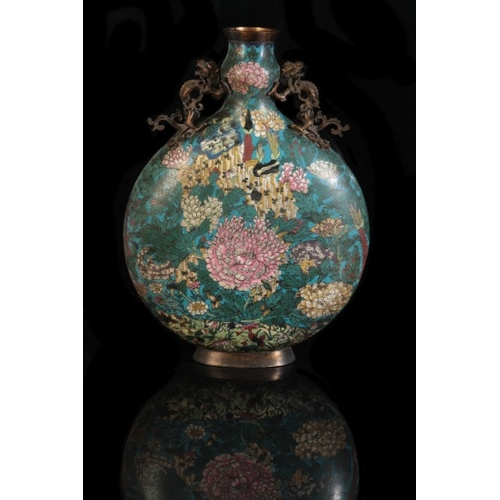 24 - A CHINESE CLOISONNE MOON FLASK

Qing, decorated with peonies against a blue ground, with bronze hand... 