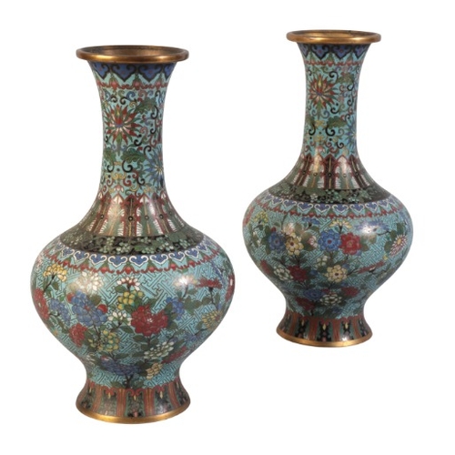 25 - A PAIR OF CHINESE CLOISONNE VASES

Qing dynasty, decorated with flowers against a blue diapered grou... 