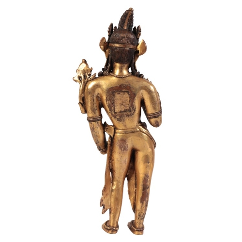 257 - A NEPALESE GILT BRONZE FIGURE OF MANJUSHRI

figured standing with a lotus flower, right palm raised,... 