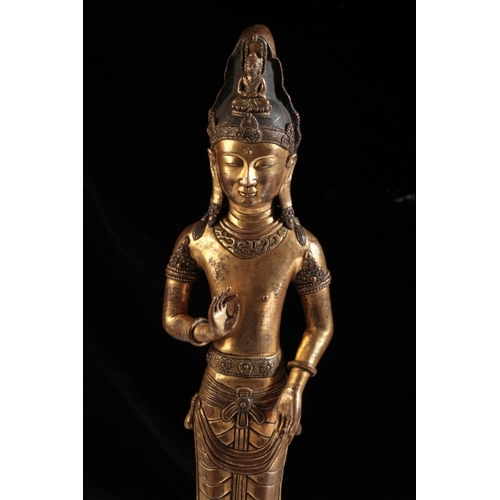 258 - A SINO-TIBETAN GILT BRONZE DEITY

probably Tang, with finely chased detail and a patinated finish to... 