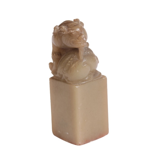 26 - A CHINESE CARVED SOAPSTONE SEAL

18th/19th century, with a qilin finial, 5cm high