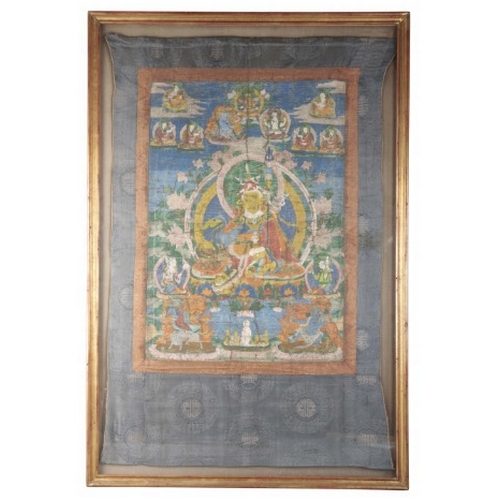 267 - A TIBETAN PADMASAMBHAVA THANGKA

19th century, depicting the Guru Rinpoche holding a kapala and staf... 