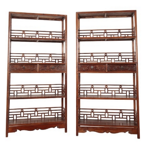 4 - A PAIR OF HUALI-WOOD DISPLAY CABINETS

20th century, the rectangular tiers with fret pierced galleri... 