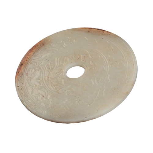 43 - A CHINESE WHITE JADE BI DISC

carved with two registers of phoenix, lions and other beasts within an... 