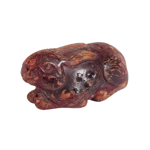 50 - A CHINESE AMBER RABBIT

late 19th/early 20th century, carved naturistically with ears back, 7cm long