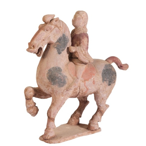 70 - A CHINESE TANG DYNASTY HORSE AND RIDER

the horse figured prancing with right foreleg raise, the fem... 