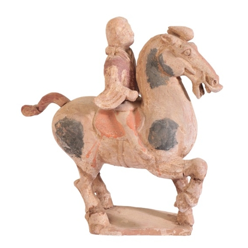 70 - A CHINESE TANG DYNASTY HORSE AND RIDER

the horse figured prancing with right foreleg raise, the fem... 