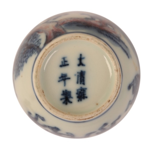 77 - A CHINESE BLUE AND WHITE SNUFF BOTTLE

bearing a six character Yongzheng mark to the base, decorated... 