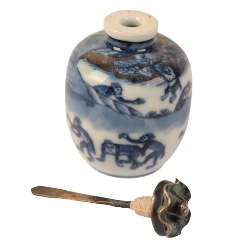 77 - A CHINESE BLUE AND WHITE SNUFF BOTTLE

bearing a six character Yongzheng mark to the base, decorated... 