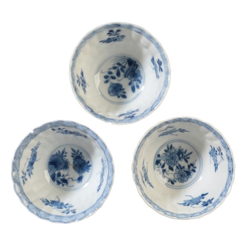 90 - THREE CHINESE CAFE AU LAIT TEA BOWLS

Kangxi, each of lobed form, decorated in blue and white to the... 