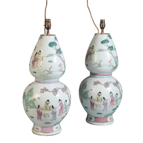 92 - A PAIR OF CHINESE FAMILLE ROSE DOUBLE GOURD VASES

19th/early 20th century, each decorated with figu... 