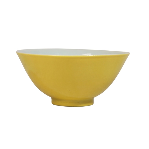 98 - A CHINESE CANARY YELLOW BOWL

with a plain interior, the base with a Qianlong sealmark in underglaze... 