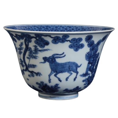 128 - A CHINESE BLUE AND WHITE BOWL early Qing or later, with an everted rim, decorated with goats in a la... 